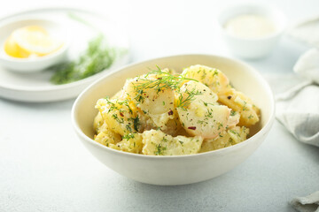 Traditional homemade potato salad with dill