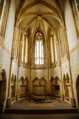 Interior of Chapel of St. Archangel Michael in medieval castle Bezdez, gothic arched windows in church, rib vault, altar part, stone carving, ruin on hill, North Bohemia, Czech Republic