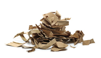 Torn paper bag pieces, scraps for recycling pile isolated on white background