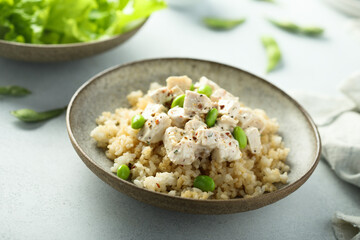 Healthy quinoa bowl with chicken and edamame beans