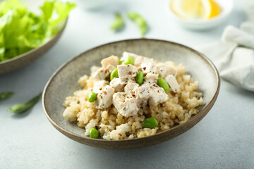 Healthy quinoa bowl with chicken and edamame beans