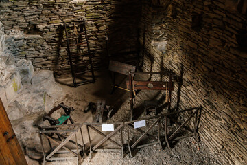 Vintage medieval Torture Equipment in museum, Rack, break-knee, Torture chamber in medieval gothic castle Bezdez, ancient fortress, fairytale stronghold, North Bohemia, Czech Republic - obrazy, fototapety, plakaty