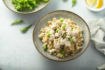 Healthy quinoa bowl with chicken and edamame beans