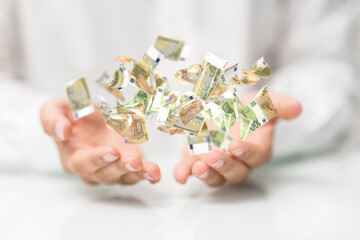 banking euro banknote in hand rain