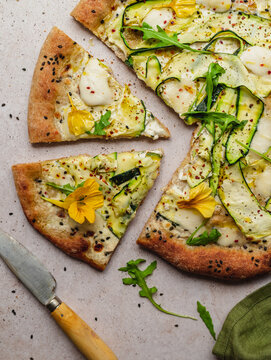 Delicious pizza with zucchini slices on gray background