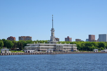 Fototapeta na wymiar Moscow, Russia - June 3, 2021: Summer view of the building of the Northern River Station from the side of the channel named after Moscow