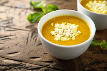 Healthy homemade pumpkin soup with cheese