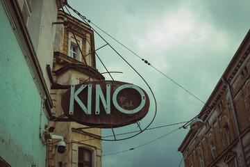 Vintage cinema neon sign in small town