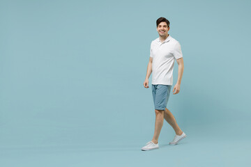 Full length young fun happy unshaven cheerful caucasian man 20s wear white basic t-shirt looking...