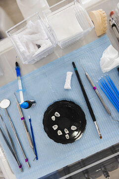 Jar with teeth between dental instruments in clinic