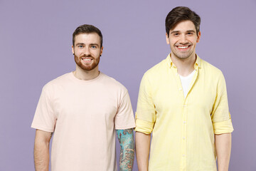 Two young caucasian cheerful positive happy cool smiling men friends together 20s wearing casual...