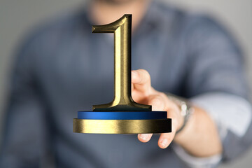 award gold winner first place in hand