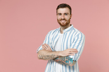 Young smiling happy cheerful friendly caucasian unshaven man 20s in blue striped shirt white...