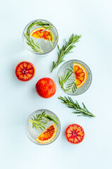 Sangria drink with blood orange grapefruit and rosemary. Top view