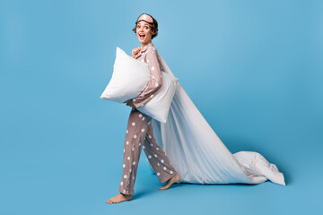 Full body profile side photo of young excited girl happy smile go sleep hold pillow blanket...