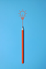 A burning light bulb and a pencil. A symbol of a difficult task and the emergence of a creative idea to solve it