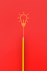 A burning light bulb and a pencil. A symbol of a difficult task and the emergence of a creative...