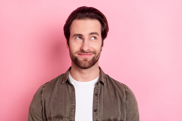 Photo of young handsome guy happy positive smile dream think look empty space isolated over pink color background