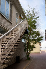 stairs to the house in the resort, next to the tree