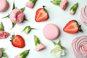 Concept of tasty macaroons and marshmallows on white background