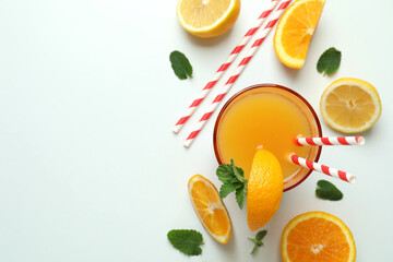 Tequila sunrise cocktail and ingredients on white background