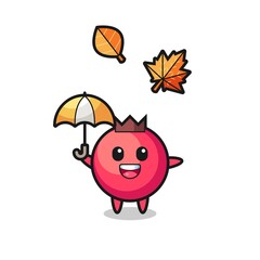 cartoon of the cute cranberry holding an umbrella in autumn