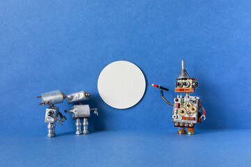 A blank template mockup for the concept of the exhibition, presentation or gallery of the museum. The robot guide and visitors view an empty poster billboard picture frame. Copy space for your design.