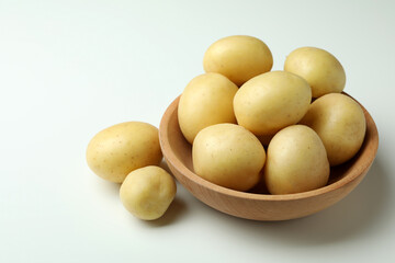 Bowl of young potato on white background