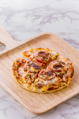Mini pizza with sausage and cheese