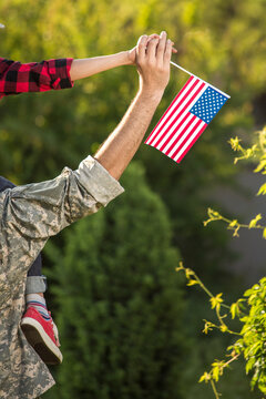 Happy reunion of soldier with family outdoors