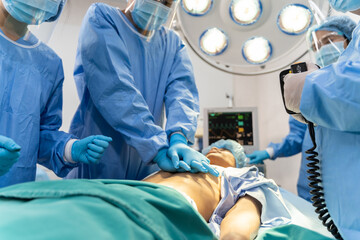 Medical team in Surgical gown help patient to making CPR Cardio Pulmonary Resuscitation in the...