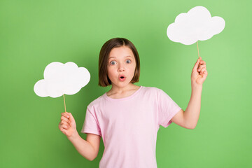 Photo of young girl amazed shocked news hold cloud bubble stick information isolated over green...