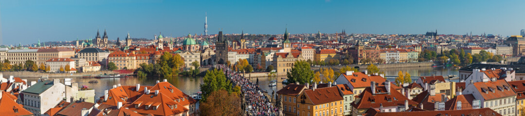 Naklejka na ściany i meble PRAGUE, CZECH REPUBLIC - OCTOBER 13, 2018: The panorama of the city with the Charles bridge and the Old Town in evening light.