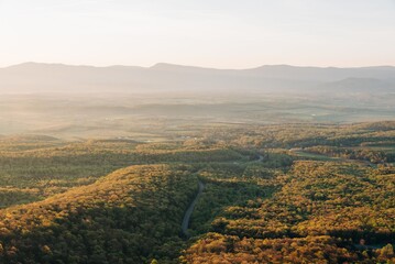 Obraz premium View of the Shenandoah Valley and Blue Ridge Mountains at sunrise, from the Massanutten Storybook Trail in Luray, Virginia