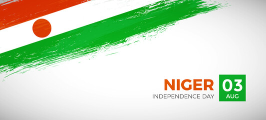 Happy independence day of Niger with brush painted grunge flag background
