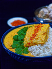 Fish in curry with rice. Indian cuisine.