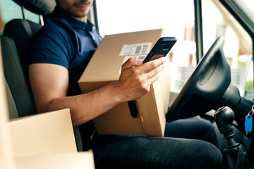 Close up of checking a package using portable information device
