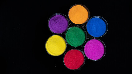 Round Of Seven Colors in Glass With Top View Isolated in Black Background