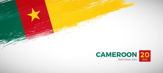 Happy national day of Cameroon with brush painted grunge flag background