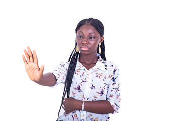 beautiful serious young woman making stop gesture with hand.