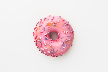 pink donut against white background