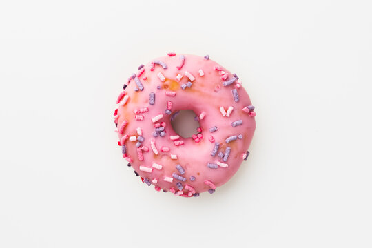 Pink Donut Against White Background