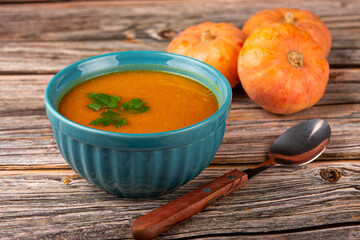 Delicious homemade pumpkin soup in bowl.