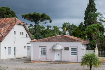 Lapa, Paran&aacute;, Brazil. Old traditional building in Lapa, Brasil. White old houses of South Brazil. Araucaria in background.