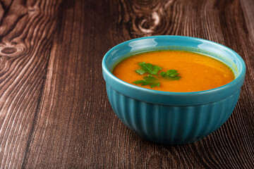 Delicious homemade pumpkin soup in bowl.