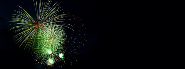 Colorful fireworks on black background. Celebration and holidays concept. Independence Day 4th of July, New Year, festival. Bright explosions of lights in sky.