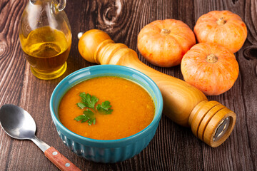 Delicious homemade pumpkin soup in bowl.