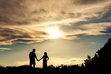 Fototapeta na wymiar silhouette, couples, family, sky, landscape, beauty, natural , fun, together, clouds, colors