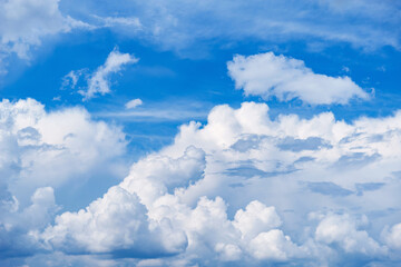 Naklejka na ściany i meble Stormy clouds on the blue sky. Cloudscape at day time.