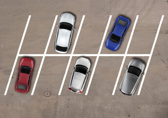 parking lot with diagonal cars parked keeping distance